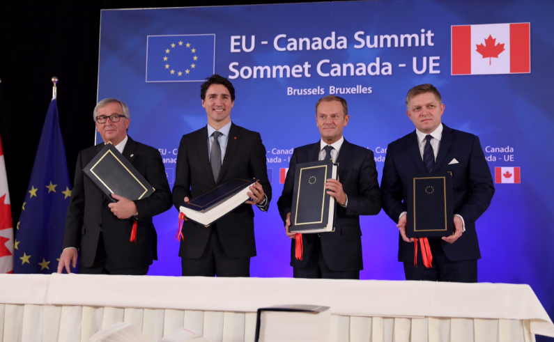 Jean-Claude Juncker, Justin Trudeau and Donald Tusk after the CETA signing ceremony. [European Council]