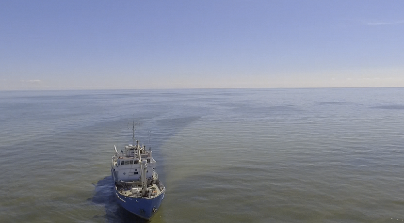 Research ship <i>Namao</i> sailing through algae bloom in Lake Winnipeg's vast north basin - photo courtesy of SoGo Productions - <i>clip from documentary "Aboard the Namao?</i>