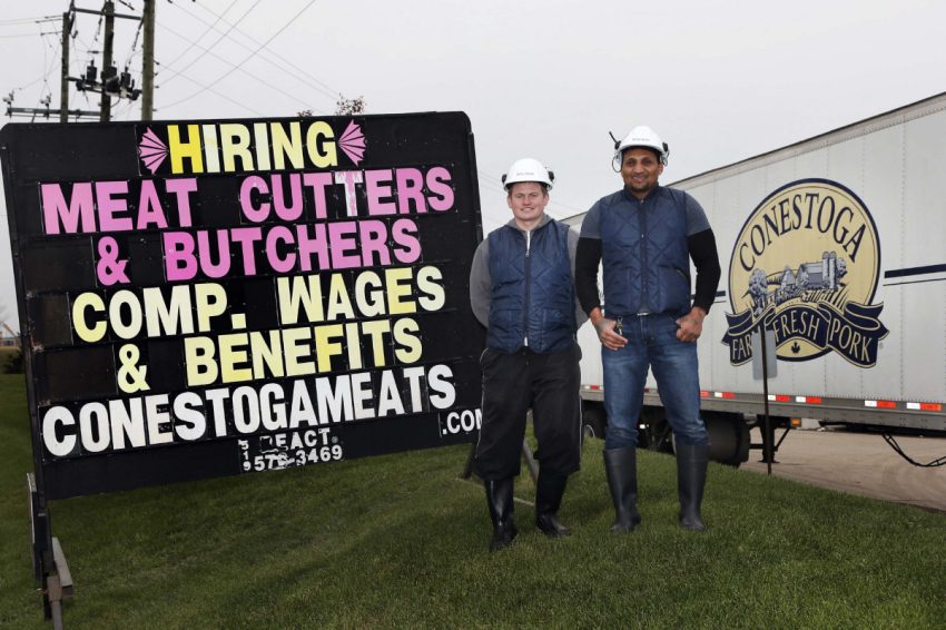 Serhiy Levytskyy, left, and Michael Marjolin are working as retail butchers at Conestoga Meats, but uncertain of their future.  (ANDREW FRANCIS WALLACE/TORONTO STAR)  