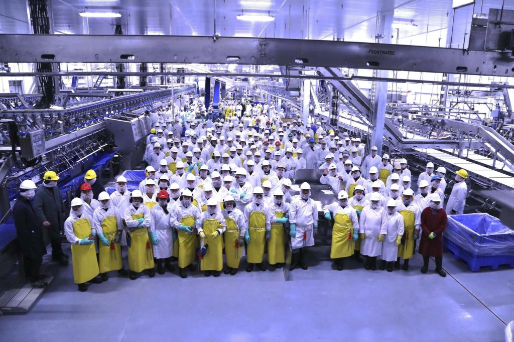 Hylife Foods staff assemble at the newly modernized Integrated Pork Processing Plant in Neepawa, part of a $176 million HyLife upgrade and expansion project.-photo credit: Winnipeg Free Press