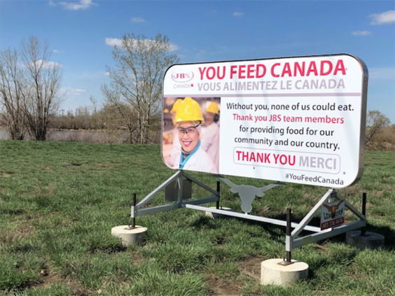 A sign outside the JBS plant in Brooks. LICIA CORBELLA / POSTMEDIA