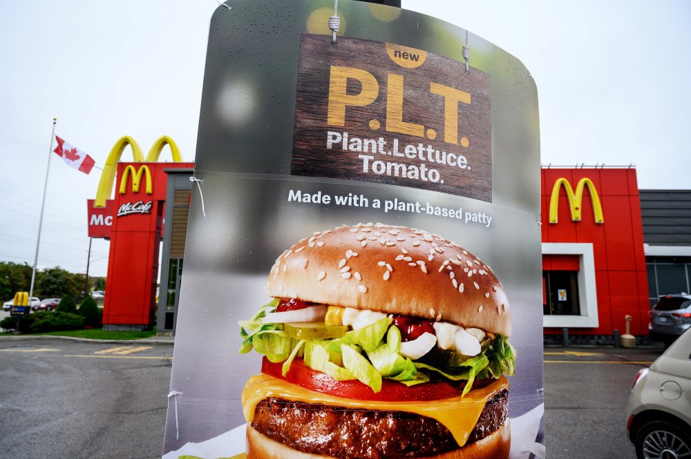 A sign promoting McDonald's "PLT" burger with a Beyond Meat plant-based patty at one of 28 test restaurant locations in London, Ontario, Canada October 2, 2019. REUTERS/Moe Doiron