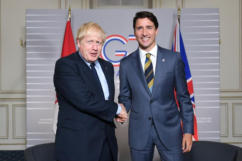 Britain's Prime Minister Boris Johnson shakes hands with Canada's Prime Minister Justin Trudeau at the G7 summit in Biarritz, France August 24, 2019. Stefan Rousseau/Pool via REUTERS