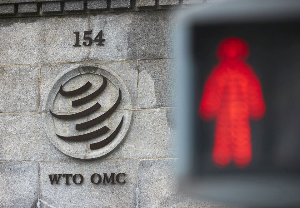 A logo is pictured on the World Trade Organisation (WTO) building before a ministerial meeting to discuss a draft agreement on curbing subsidies for the fisheries industry in Geneva, Switzerland, July 15, 2021. REUTERS/Denis Balibouse/File Photo