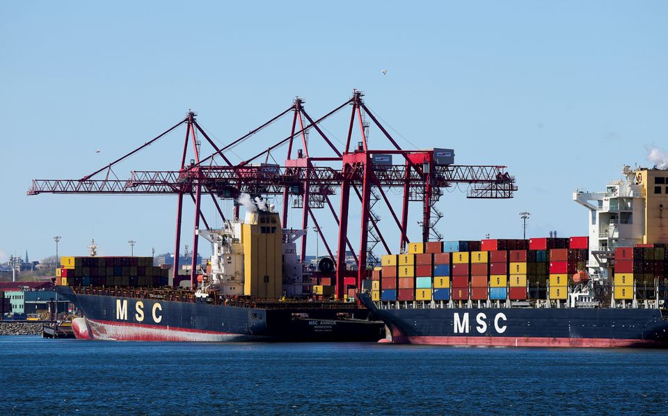 Cargo ships with their shipping containers are seen in the Port of Montreal in Montreal, Quebec, Canada, May 6, 2021. REUTERS/Christinne Muschi/File Photo