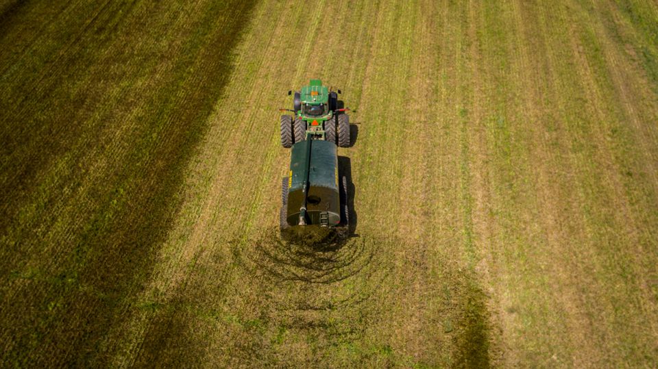 A custom hauler spreads dairy manure on hay ground using a Husky Farm Equipment 18000L Slimline Liquid Manure Spreader on a farm in Wallenstein, Ontario, U.S., in the spring of 2018. Husky Farm Equipment Ltd./Handout via REUTERS