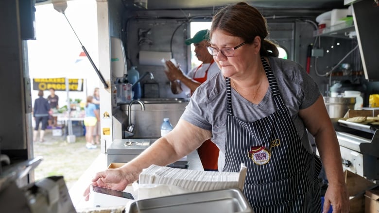 Carolina De La Torre, co-owner of the Arepas Ranch food truck, says the soaring costs of food, gas and propane has caused problems for her business. (Axel Tardieu/Radio-Canada)