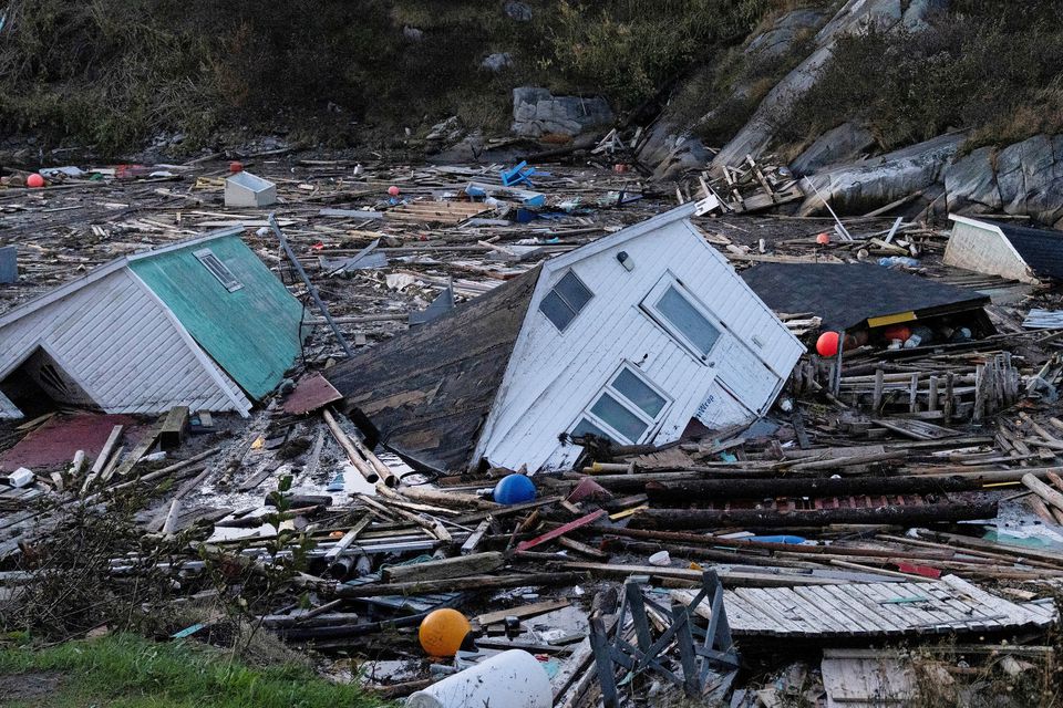 Structures float in the water in the aftermath of Hurricane Fiona in Rose Blanche, Newfoundland, Canada September 25, 2022. REUTERS/John Morris/File Photo