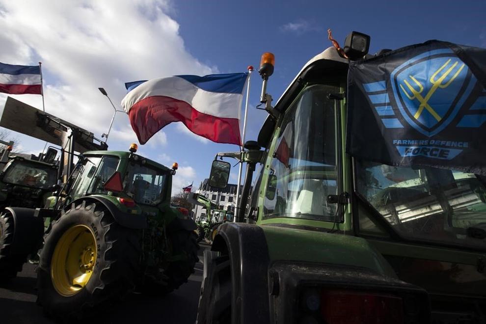 The Farmers Defense Force flag, right, and Dutch flags, fly in the wind on an intersection blocked by tractors in The Hague, Netherlands, Wednesday, Feb. 19, 2020. The Dutch government plans to drastically cut emissions of nitrogen pollution cleared a key hurdle Tuesday, May 2, 2023 when the European Union's executive arm gave the green light to farm buyout schemes worth nearly 1.5 billion euros ($1.65 billion). (AP Photo/Peter Dejong, File)
PDJ