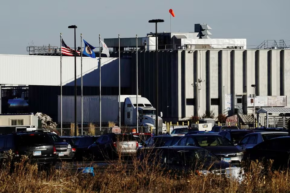 A semi truck and trailer exit the JBS USA Worthington pork plant in Worthington, Minnesota, U.S., October 28, 2020. REUTERS/Bing Guan/File Photo